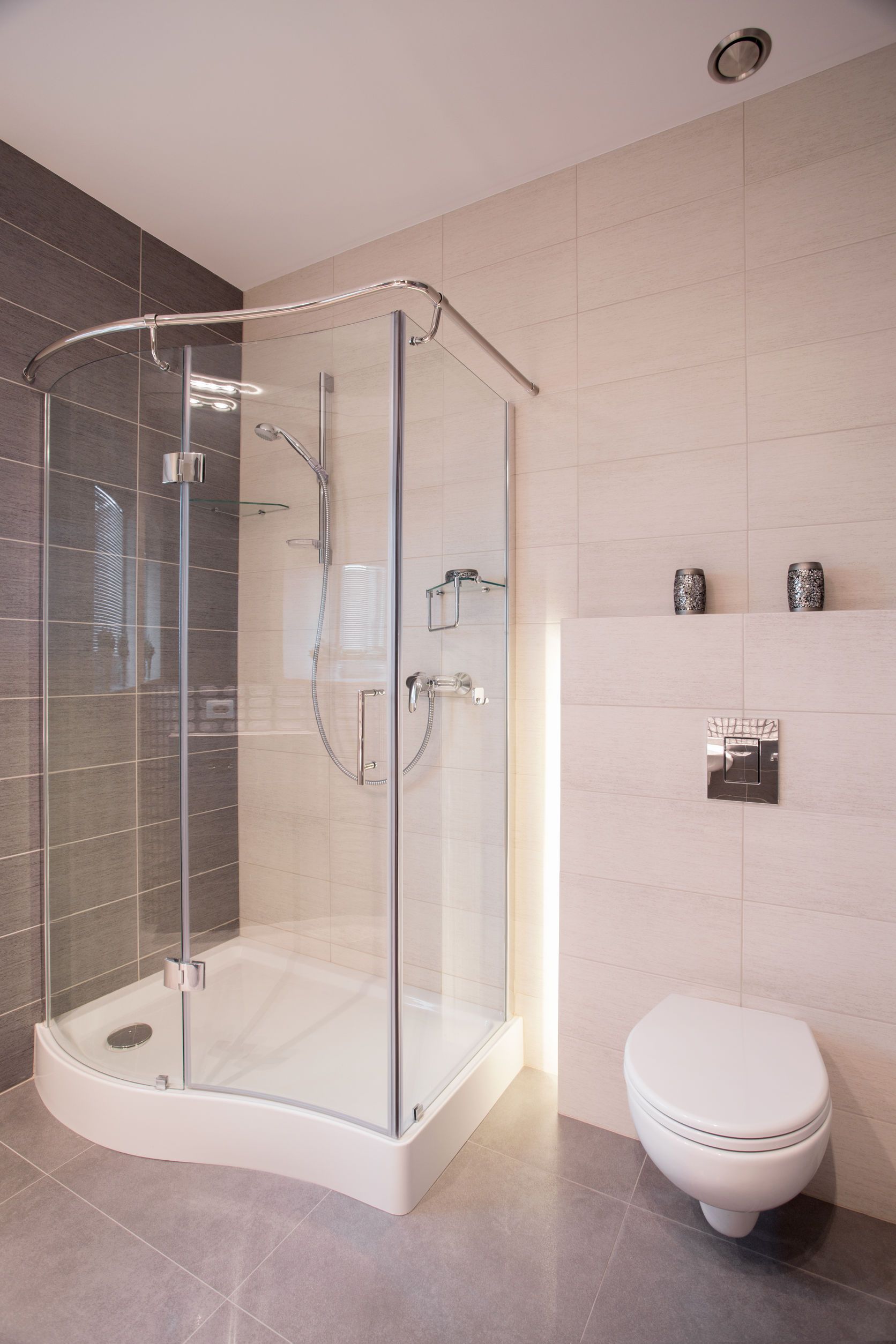 Glass shower and porcelain toilet in new bathroom